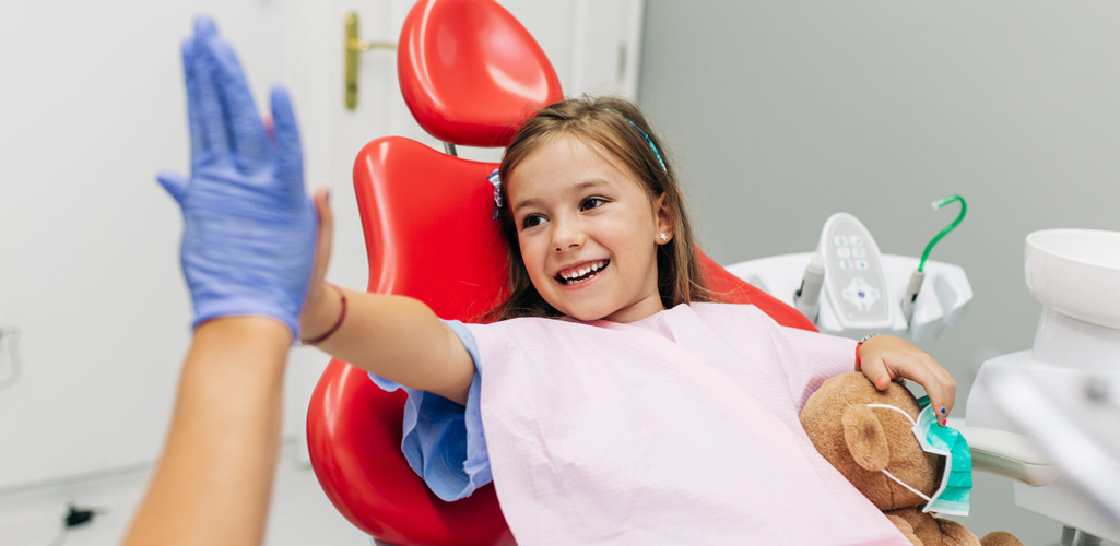Child smiling at dentist
